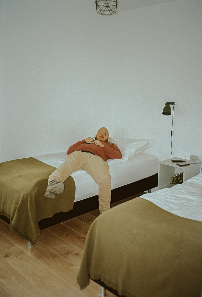 Rachel Bond's husband relaxing in his twin bed after one of their explorations in Iceland. 