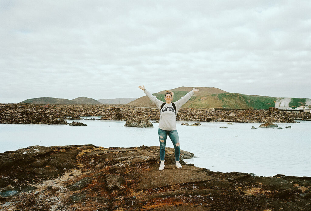 Rachel Bond found standing at one of Iceland's monumental locations celebrating her Romantic Iceland Anniversary Celebration.