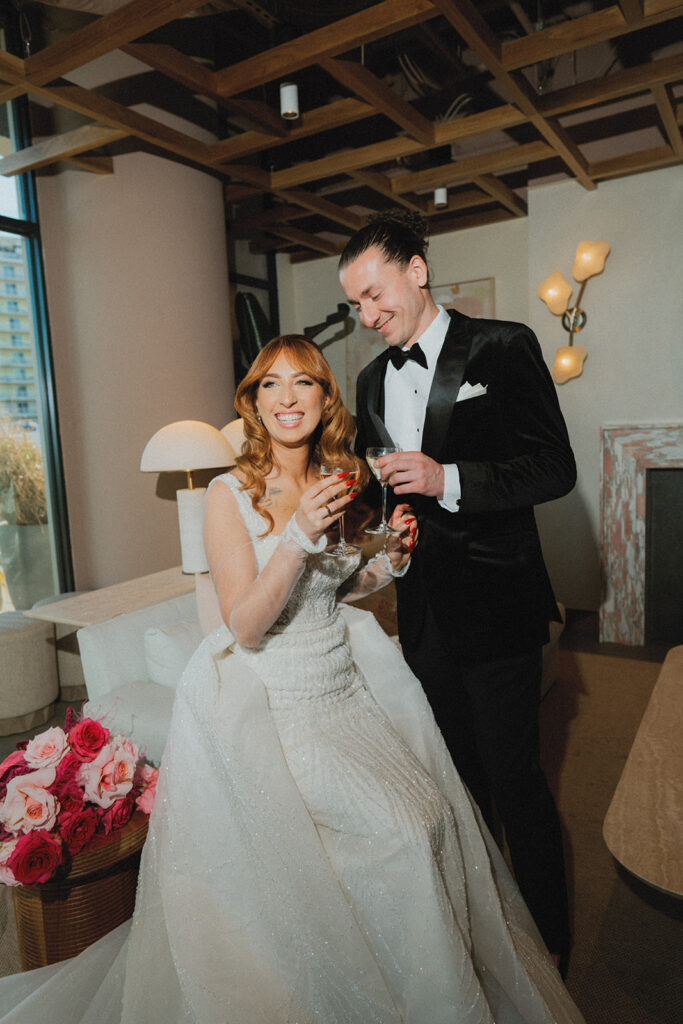 A bride & groom toast to their wave resort long branch wedding