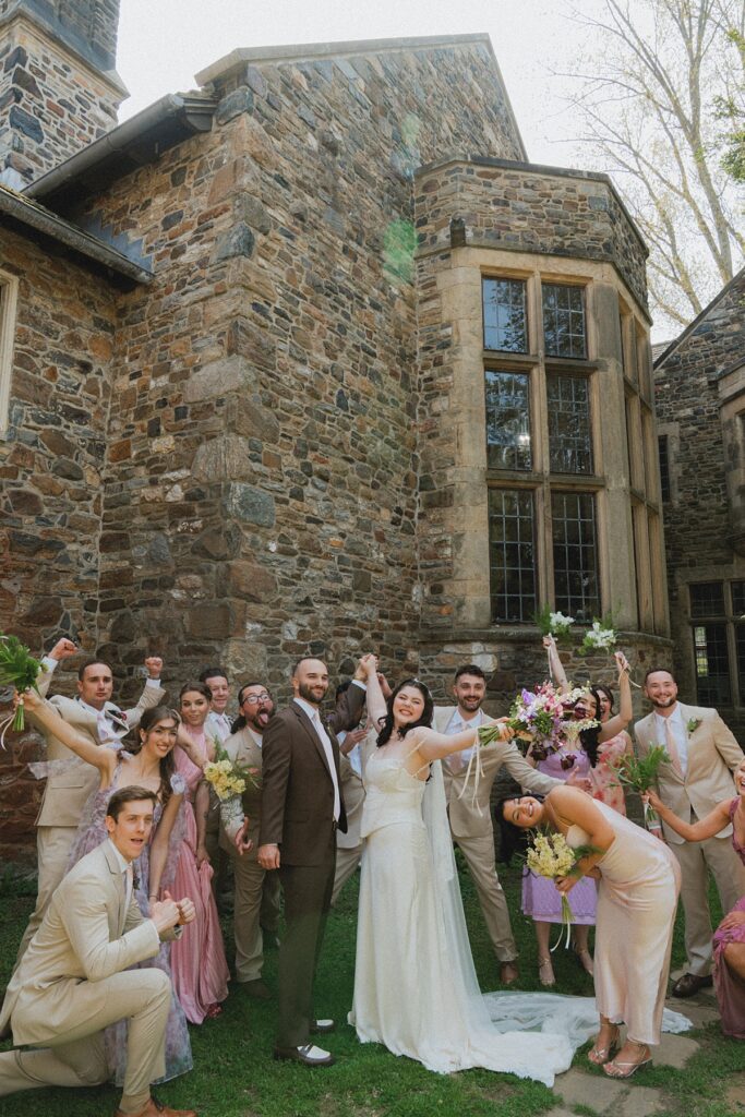 A bridal party celebrate at ridley creek state park mansion