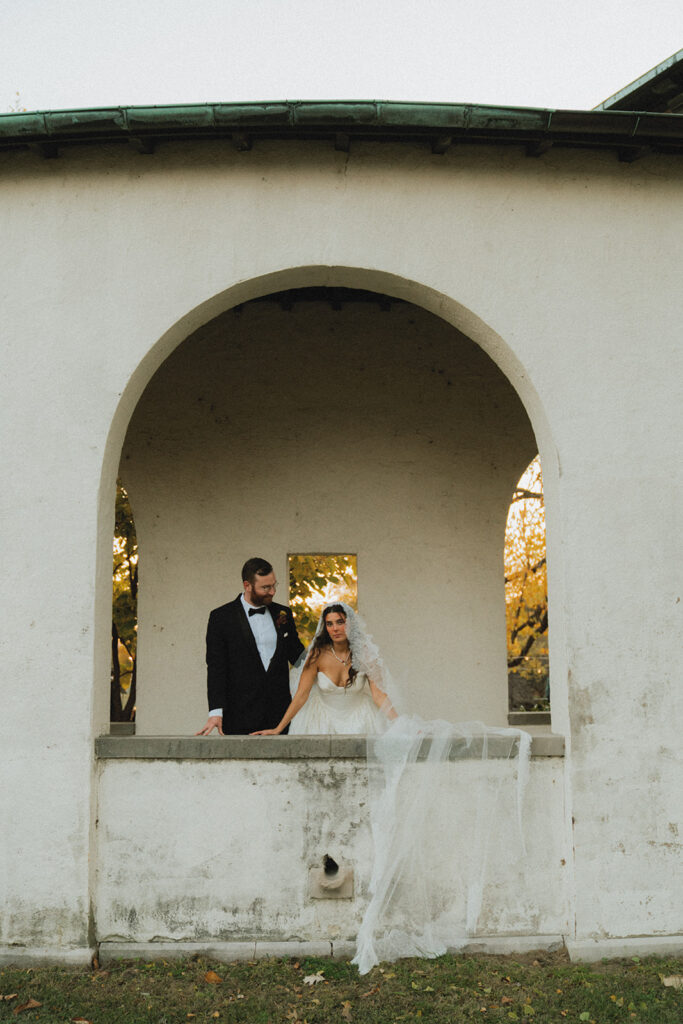 Newlyweds pose at golden hour for photos at their philadelphia art museum wedding 