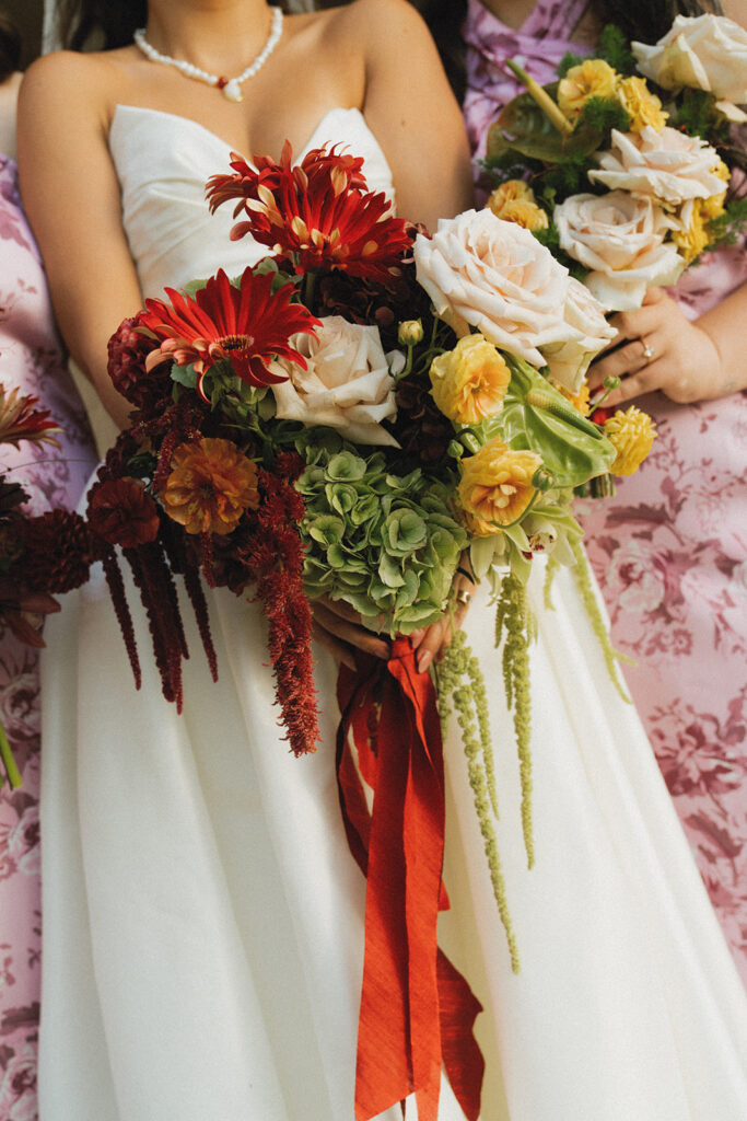 A bridal bouquet designed by Caroline Florals is photographed at an american swedish historical museum wedding