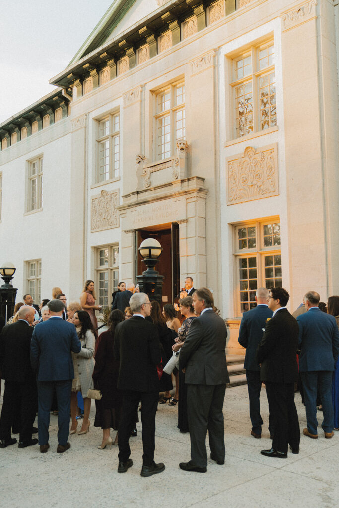 Guests mingle in the courtyard at a philadelphia art museum wedding reception